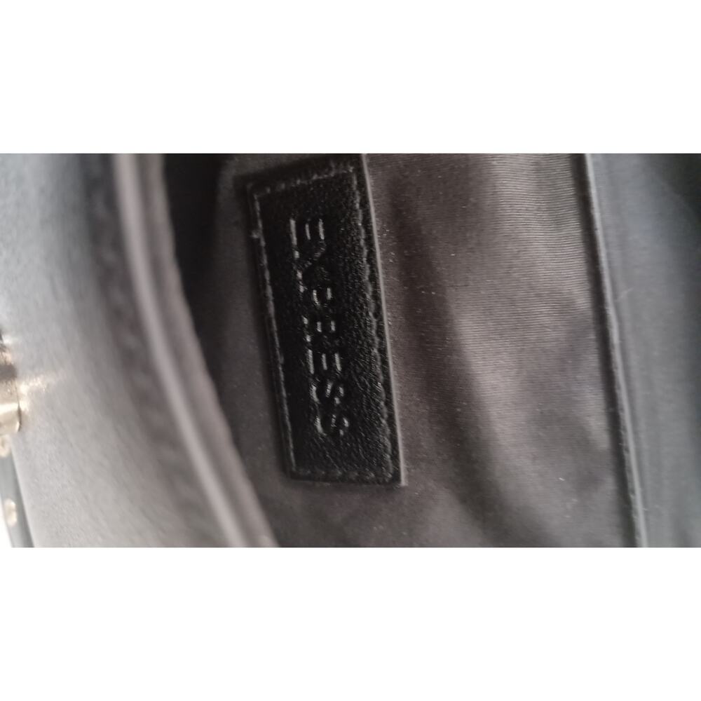 The Express Black Crossbody embellished with Bow metal grommets flap  closure. - Picture 10 of 12